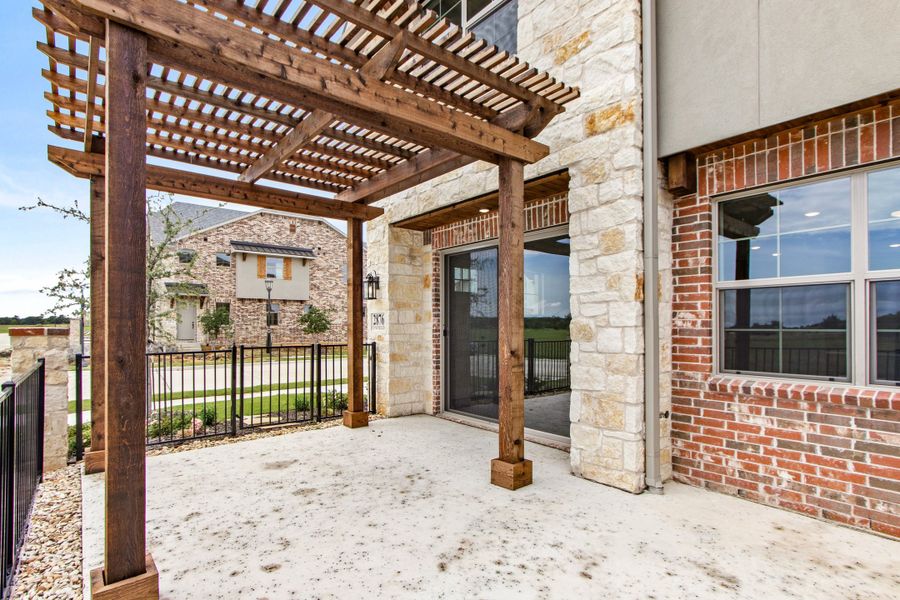 Exterior details and patio area of a home in The Tribute, The Colony (Image 4). Exterior details and patio area of a home in The Tribute, The Colony (Image 4).