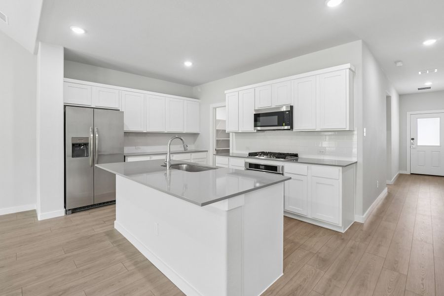 Kitchen in the Masters home plan by Trophy Signature Homes