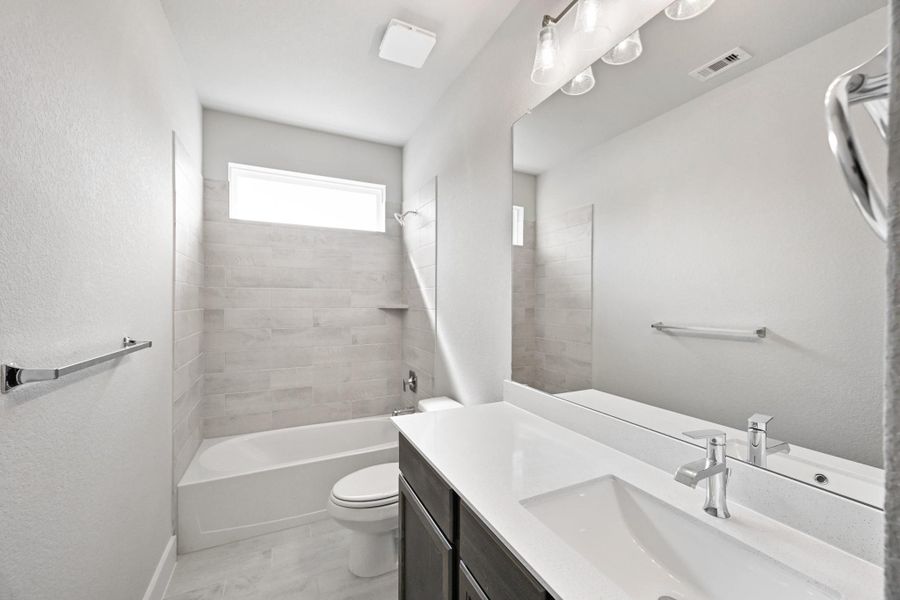 Furnished interior view inside a new home in Barton Creek Ranch, Conroe (Image 12).