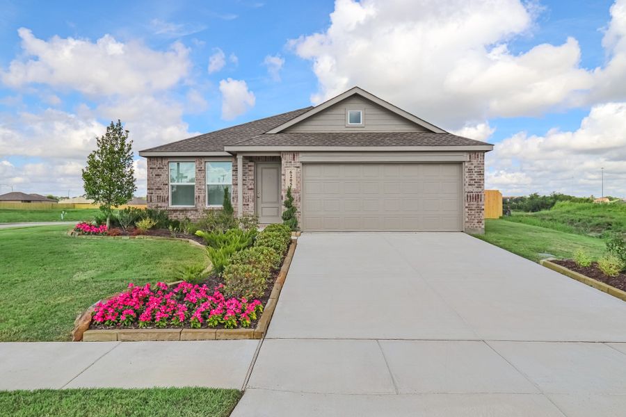 Front exterior of a new home in Timbers Edge, Splendora, TX, highlighting curb appeal (Image 1). Front exterior of a new home in Timbers Edge, Splendora, TX, highlighting curb appeal (Image 1).