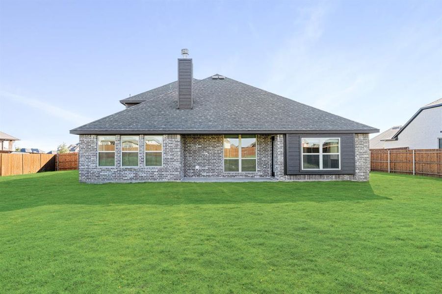 Exterior details and patio area of a home in Coyote Crossing, Godley (Image 28).