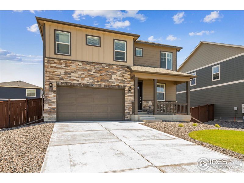 Front exterior of a new home in Mallard Ridge, Johnstown, CO, highlighting curb appeal (Image 2). Front exterior of a new home in Mallard Ridge, Johnstown, CO, highlighting curb appeal (Image 2).