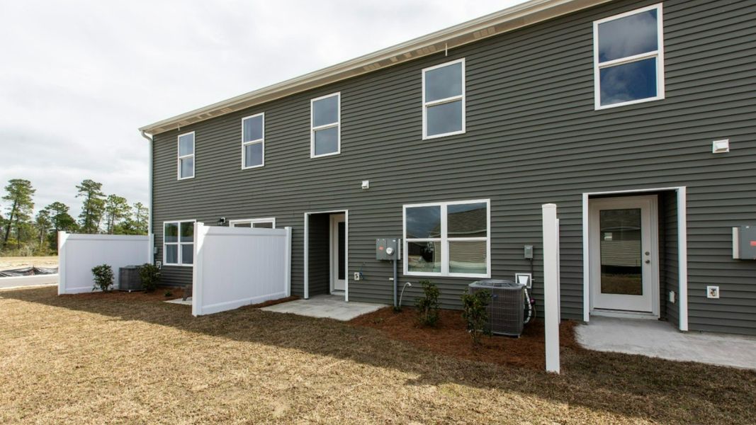 Representative exterior photo of a completed home built from the PEARSON TOWNHOME by D.R. Horton in Grayson Park Townhomes, Leland, NC (Image 26).