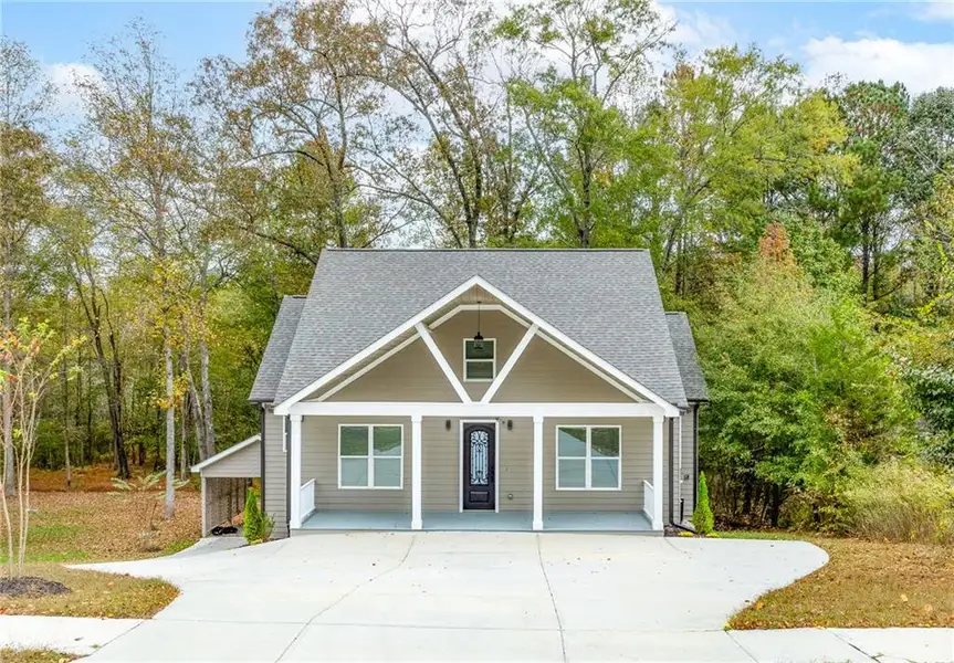 Front exterior of a new home in , Lawrenceville, GA, highlighting curb appeal (Image 2).