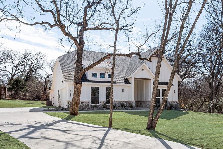 Front exterior of a new home in , Azle, TX, highlighting curb appeal (Image 19). Front exterior of a new home in , Azle, TX, highlighting curb appeal (Image 19).