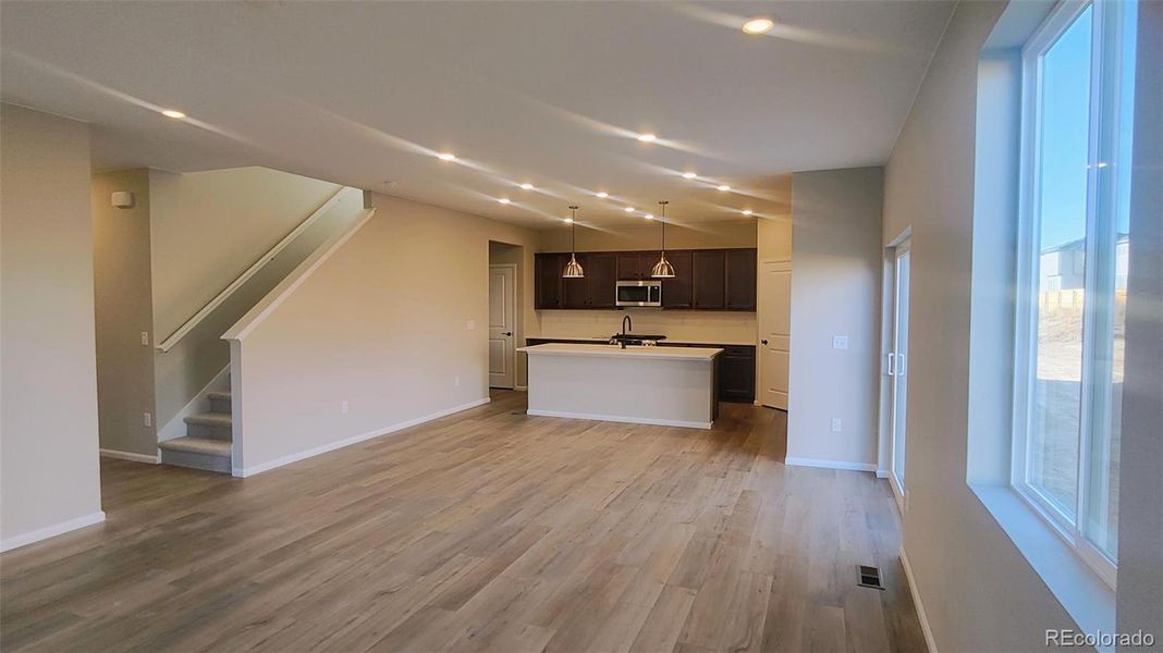 Spacious, unfurnished interior of a new home in The Cottages Collection at Ridgeline Vista, Brighton (Image 8).