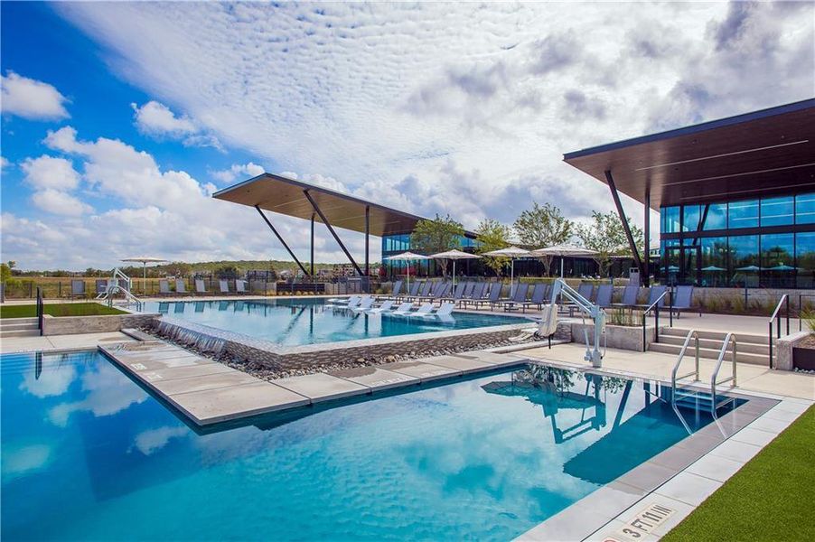 Community pool with a patio