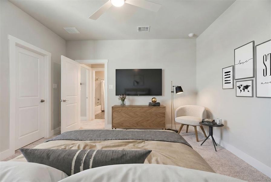 Carpeted room with light gray walls, a white ceiling fan, and white trim