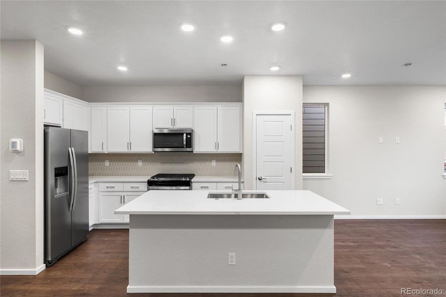 Furnished interior view inside a new home in Painted Prairie, Aurora (Image 6).