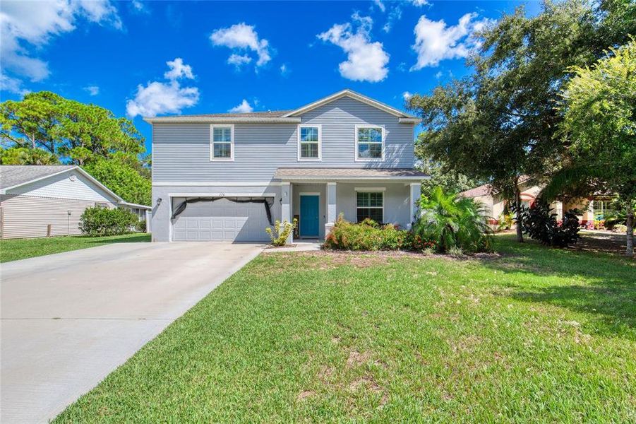 Front exterior of a new home in , Port Orange, FL, highlighting curb appeal (Image 18).