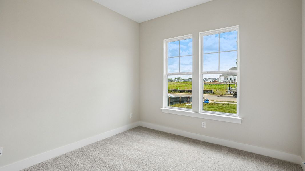 Guest bedroom at the front of the home with en-suite bathroom