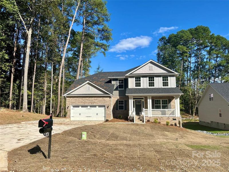 Front exterior of a new home in Crystal Village, Albemarle, NC, highlighting curb appeal (Image 1). Front exterior of a new home in Crystal Village, Albemarle, NC, highlighting curb appeal (Image 1).