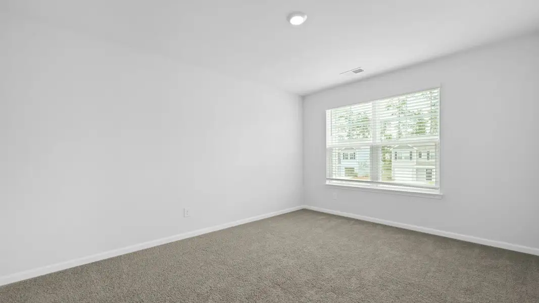 Spacious, unfurnished interior of a new home in Pine Hills Townhomes at Cane Bay, Summerville (Image 25). Spacious, unfurnished interior of a new home in Pine Hills Townhomes at Cane Bay, Summerville (Image 25).