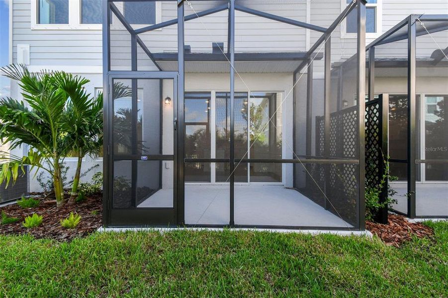 Exterior details and patio area of a home in North River Ranch – Townhomes, Parrish (Image 27).