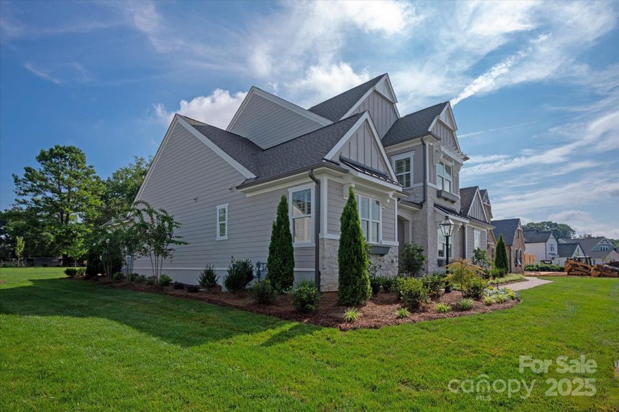 Front exterior of a new home in , Huntersville, NC, highlighting curb appeal (Image 26).