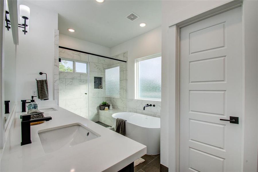 Beautiful Primary Bath with Quartz double sink vanity top and soft close drawers and doors. Model home photos, finishes and floor plan MAY VARY!