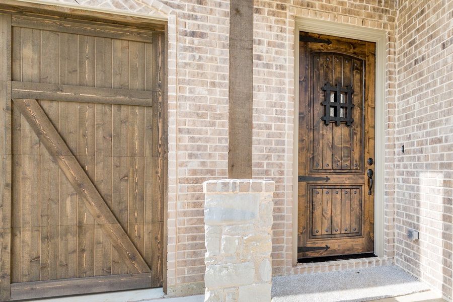 Representative exterior details of a home built from the The Michie by West Point Homes in Riverdance, Keller (Image 2). Representative exterior details of a home built from the The Michie by West Point Homes in Riverdance, Keller (Image 2).