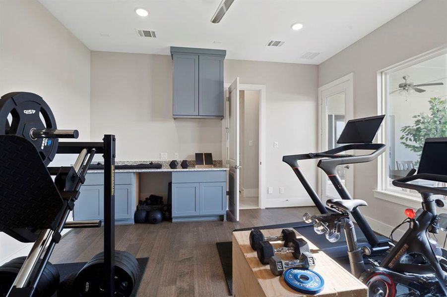 So many options... an exercise room as currently set up; but do you have a family member that you think could move in with you in the future?  notice the space in the background for a possible kitchen in the future