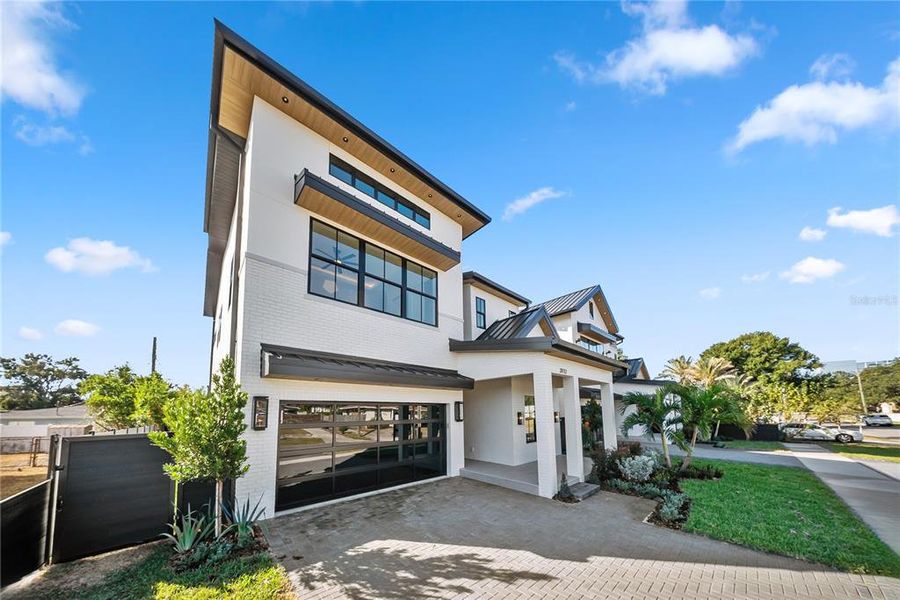 Front exterior of a new home in , Tampa, FL, highlighting curb appeal (Image 26).