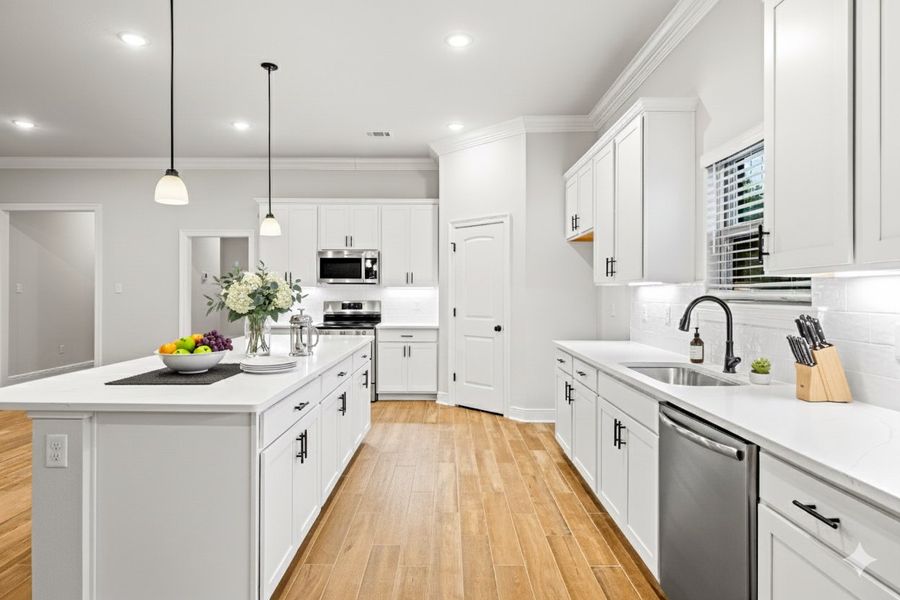 Front exterior of a new home in Bird Song at Hammock Bay, Freeport, FL, highlighting curb appeal (Image 2).