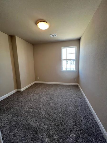 Bathroom featuring visible vents, toilet, tile patterned floors, tub / shower combination, and vanity