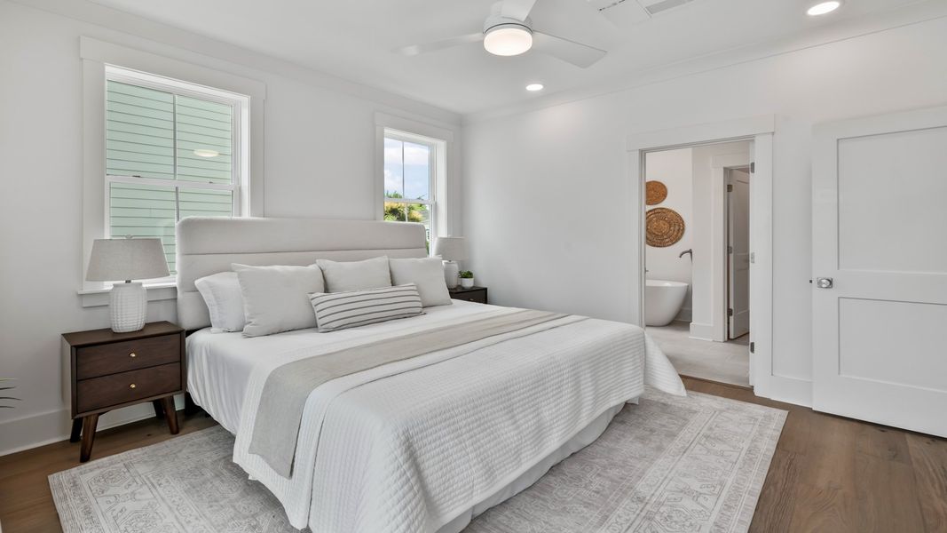 The Sullivan primary suite offers a spacious retreat with stylish finishes and abundant natural light.