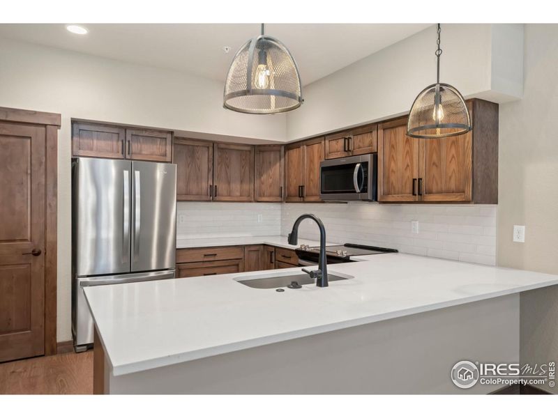 Quartz counter tops and pantry.