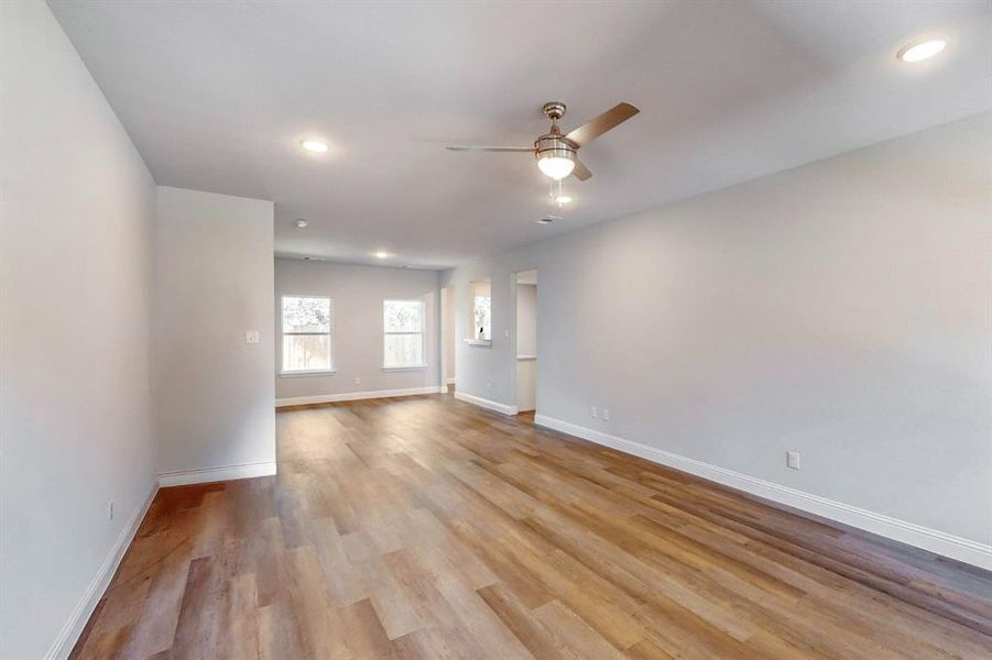 Unfurnished room featuring light hardwood / wood-style floors and ceiling fan