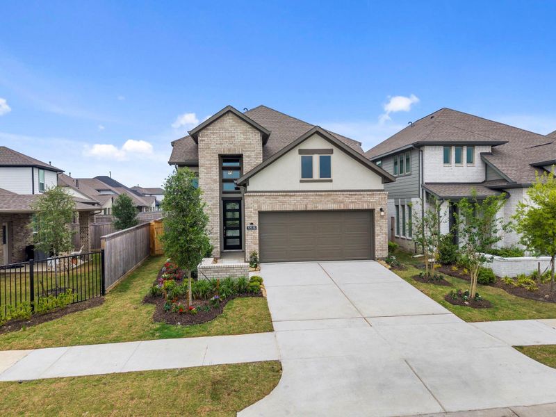 Front exterior of a new home in Bridgeland, Cypress, TX, highlighting curb appeal (Image 20).