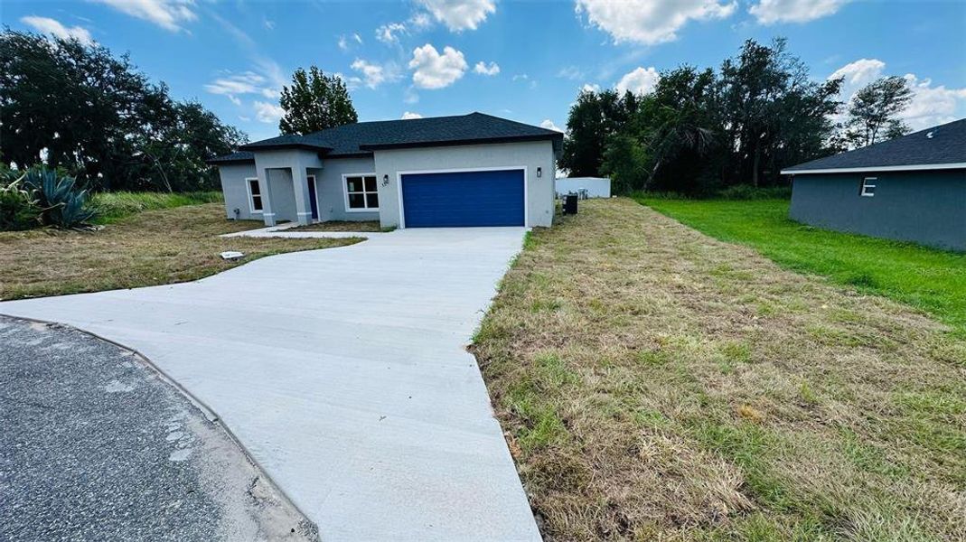 Front exterior of a new home in , Ocala, FL, highlighting curb appeal (Image 10).