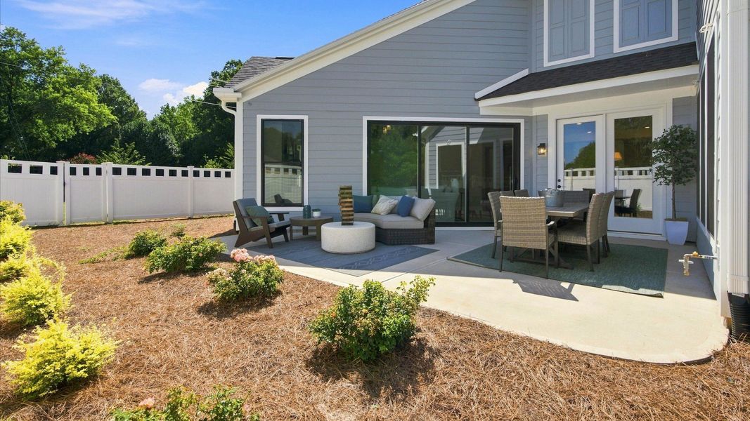 Exterior details and patio area of a home in The Courtyards at Hodges Farm, Charlotte (Image 3).