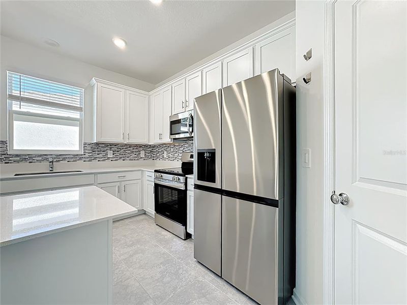 Furnished interior view inside a new home in , Kissimmee (Image 6).