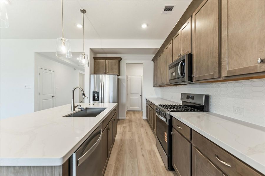 Furnished interior view inside a new home in Sunterra, Katy (Image 6).