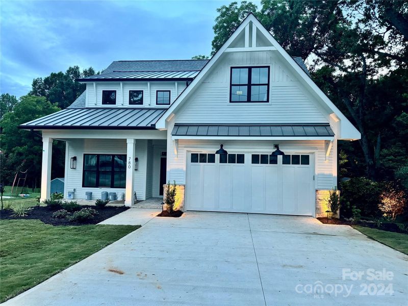 Metal Roofing + Tall & 18’ Wide Garage Door