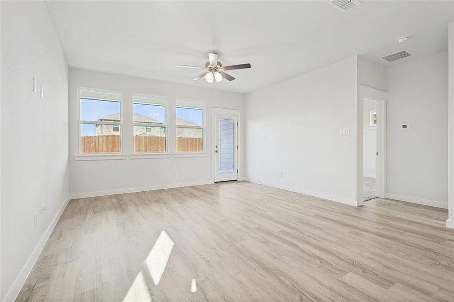 Unfurnished room featuring light hardwood / wood-style floors and ceiling fan