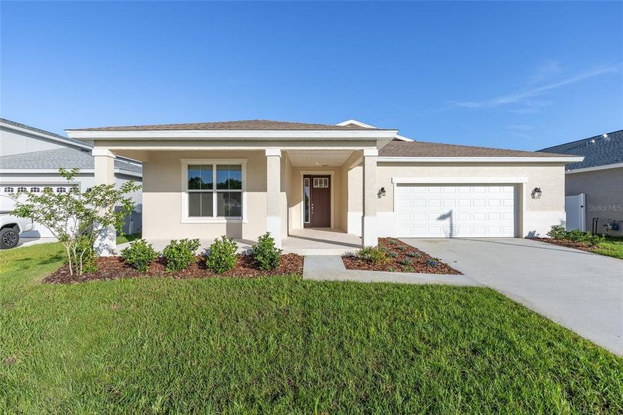 Front exterior of a new home in Calesa Township, Ocala, FL, highlighting curb appeal (Image 1). Front exterior of a new home in Calesa Township, Ocala, FL, highlighting curb appeal (Image 1).