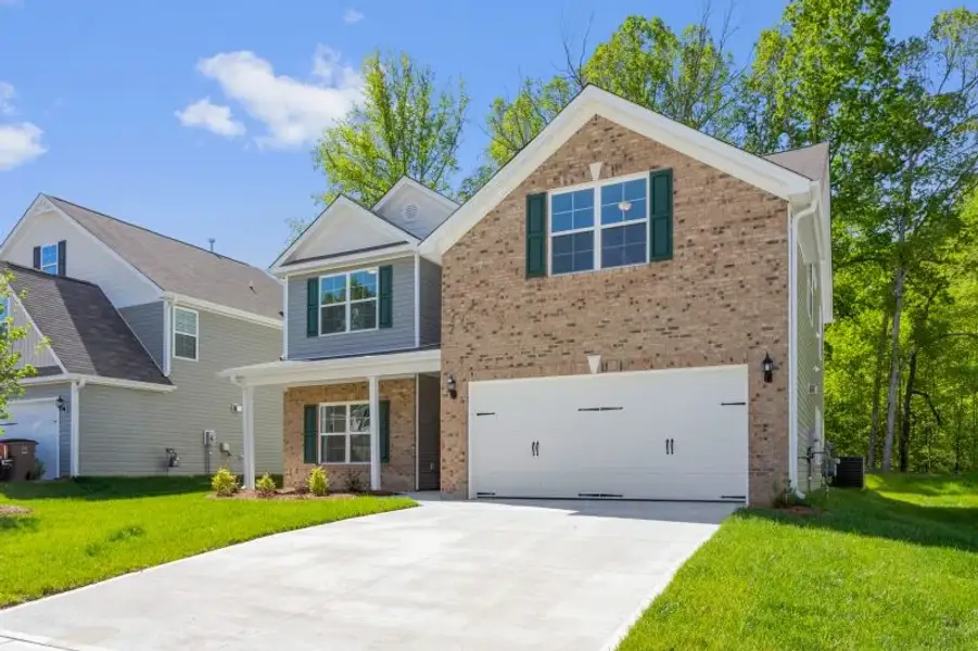 Front exterior of a new home in Trinity Meadows, Trinity, NC, highlighting curb appeal (Image 2). Front exterior of a new home in Trinity Meadows, Trinity, NC, highlighting curb appeal (Image 2).