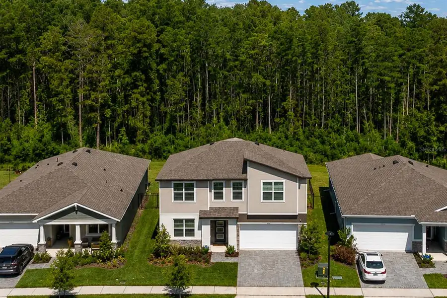 Front exterior of a new home in Meridian Parks, Orlando, FL, highlighting curb appeal (Image 1). Front exterior of a new home in Meridian Parks, Orlando, FL, highlighting curb appeal (Image 1).