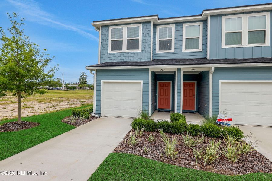 Front exterior of a new home in , Jacksonville, FL, highlighting curb appeal (Image 24).