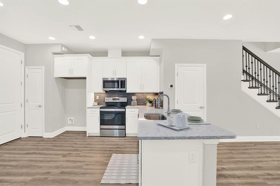Furnished interior view inside a new home in The Towns At Long Bayou, Seminole (Image 10).