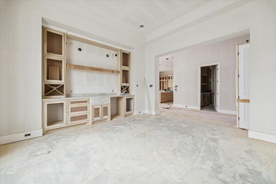 An elegant dining room anchored by bespoke millwork and thoughtfully integrated storage. The custom built in creates architectural interest while enhancing functionality, blending beauty with purpose. Positioned for seamless connectivity to the heart of the home, this space elevates both formal entertaining and intimate family dinners. An elegant dining room anchored by bespoke millwork and thoughtfully integrated storage. The custom built in creates architectural interest while enhancing functionality, blending beauty with purpose. Positioned for seamless connectivity to the heart of the home, this space elevates both formal entertaining and intimate family dinners.