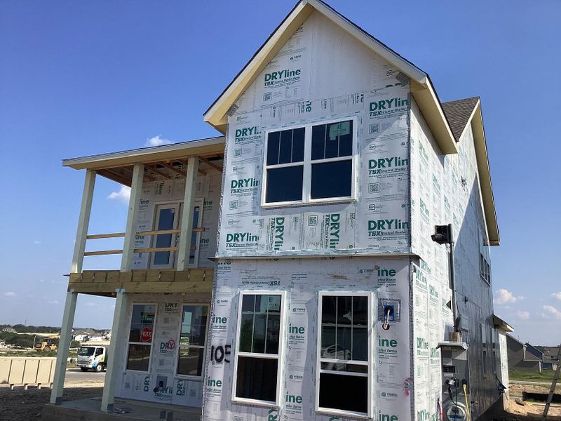 Front exterior of a new home in The Cottages at Lariat, Liberty Hill, TX, highlighting curb appeal (Image 13). Front exterior of a new home in The Cottages at Lariat, Liberty Hill, TX, highlighting curb appeal (Image 13).