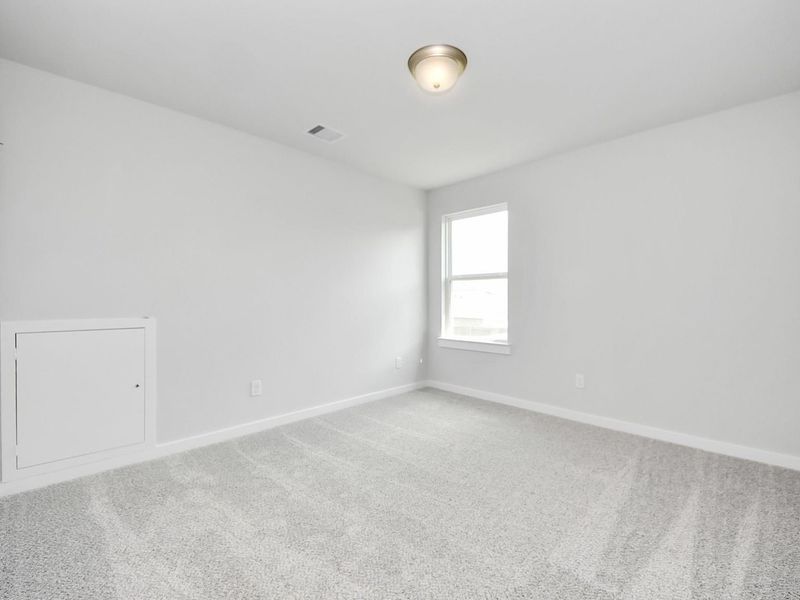 Spacious, unfurnished interior of a new home in Sunterra, Katy (Image 28).