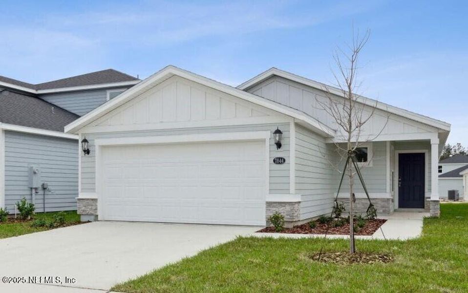 Front exterior of a new home in Kings Preserve, Jacksonville, FL, highlighting curb appeal (Image 2).