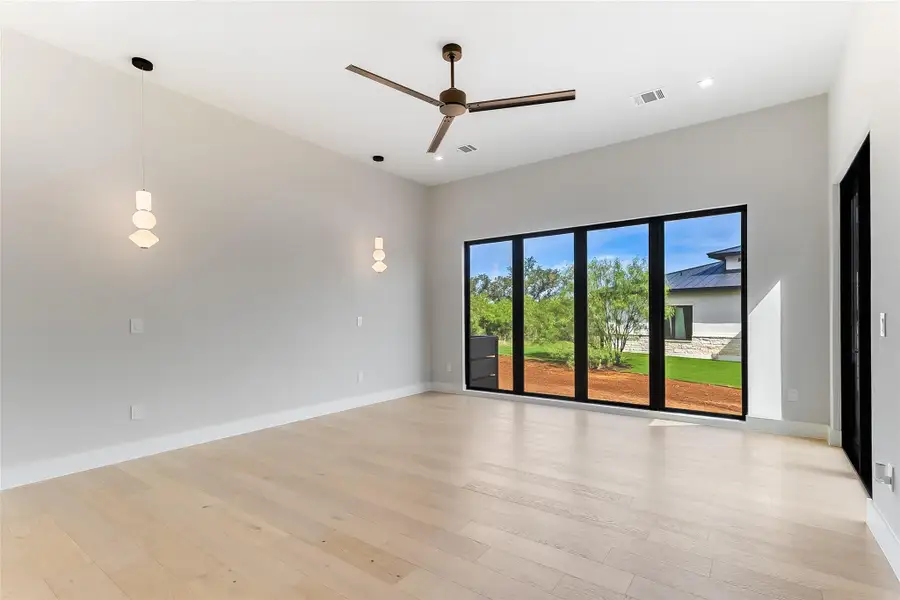 Unfurnished room featuring a ceiling fan, light wood-style flooring, baseboards, and recessed lighting Unfurnished room featuring a ceiling fan, light wood-style flooring, baseboards, and recessed lighting