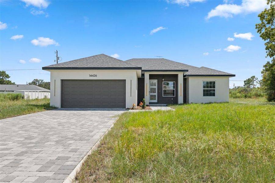 Front exterior of a new home in , Ocala, FL, highlighting curb appeal (Image 20). Front exterior of a new home in , Ocala, FL, highlighting curb appeal (Image 20).