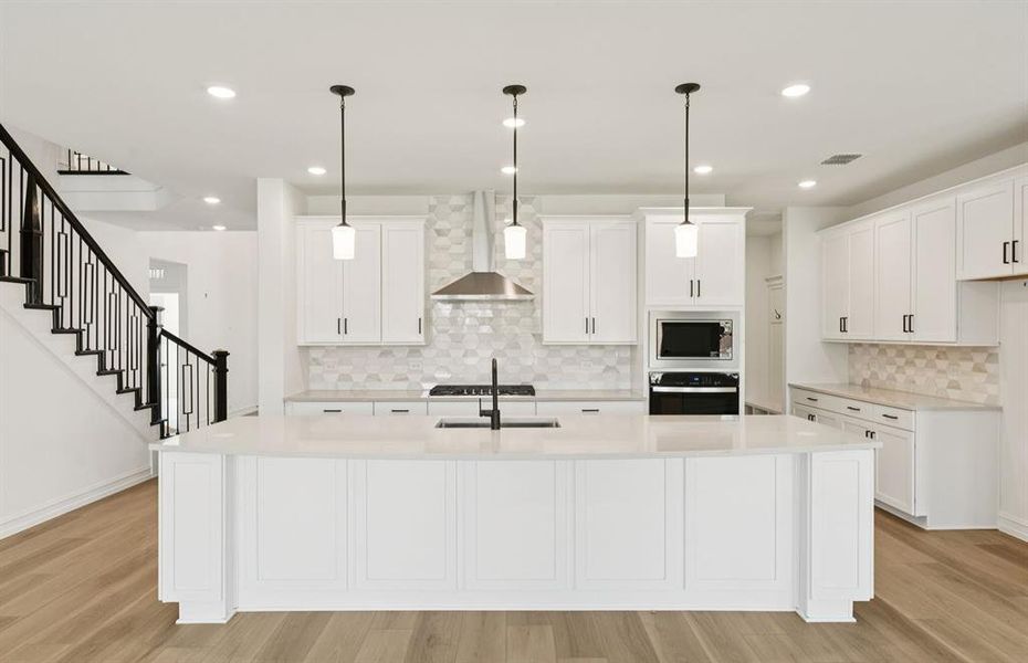 Spacious eat-in kitchen designed with a large island for dining Spacious eat-in kitchen designed with a large island for dining