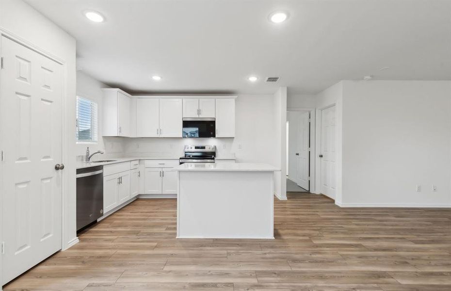 Airy kitchen with ample cabinet space *real home pictured