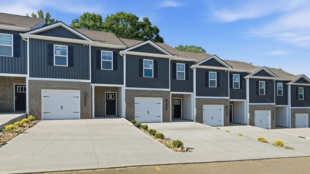 Front exterior of a new home in Macon Townhomes, Seymour, TN, highlighting curb appeal (Image 2). Front exterior of a new home in Macon Townhomes, Seymour, TN, highlighting curb appeal (Image 2).