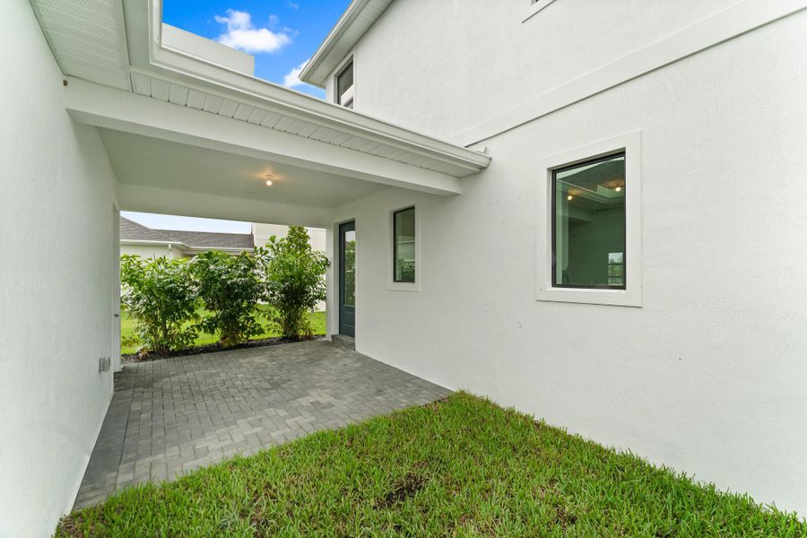 Exterior details and patio area of a home in Newfield - Rosette Park, Palm City (Image 3).